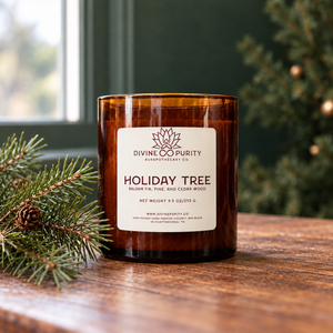 Divine Purity Holiday Tree candle with evergreen branches