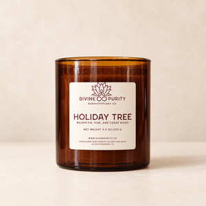 Divine Purity Holiday Tree candle on a warm cream background with a soft shadow