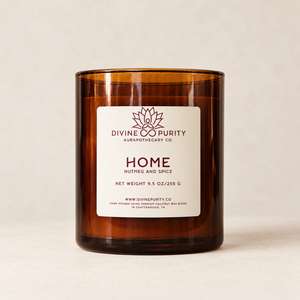 Divine Purity Home candle on a warm cream background with a soft shadow
