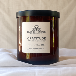 gratitude candle in previous packaging with white label